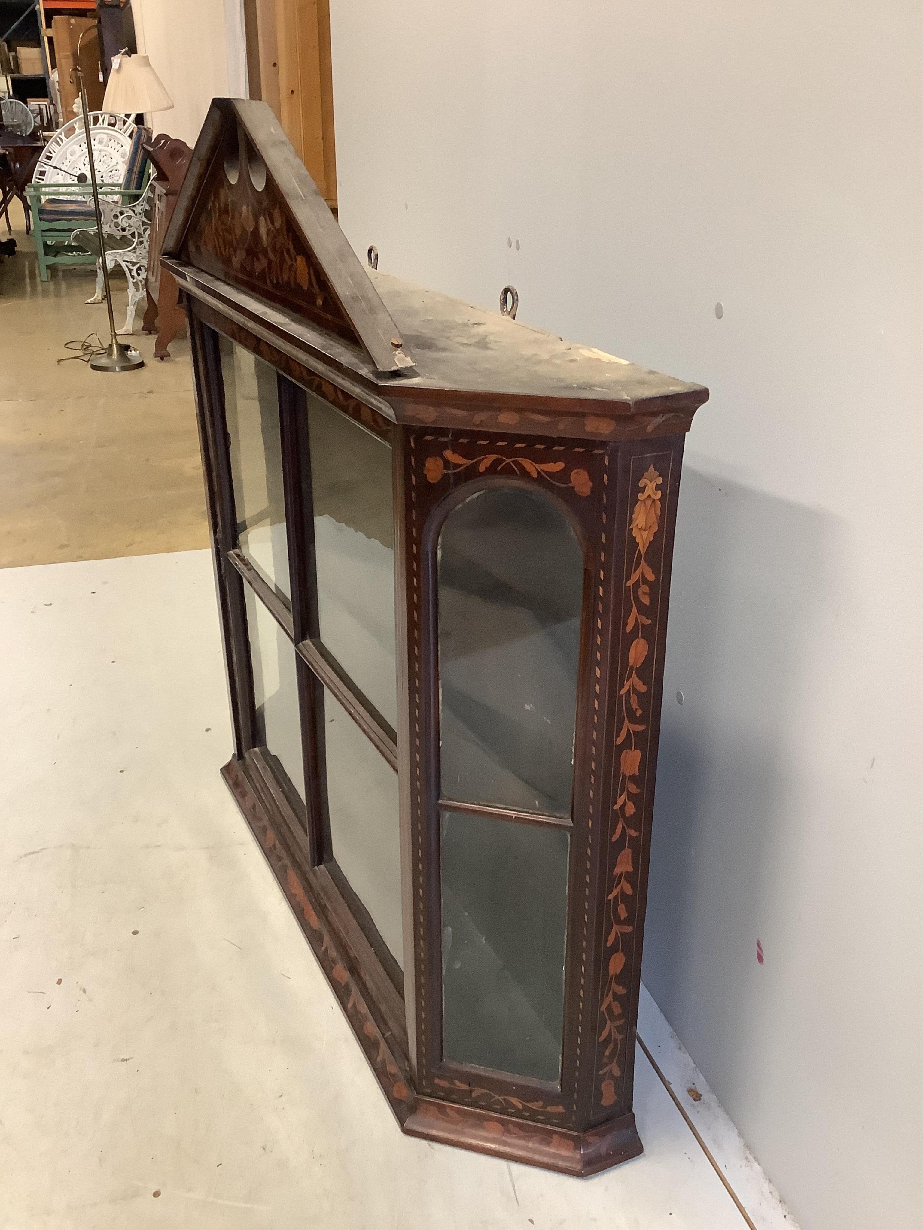 An early 19th Dutch floral marquetry inlaid walnut wall cabinet, (locked,no key), width 110cm, depth 24cm, height 97cm. Condition - fair